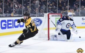 Jake DeBrusk helping Bruins