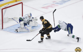 Bruins cruise past Canucks