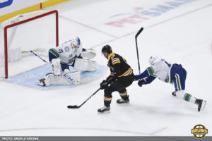 Bruins cruise past Canucks